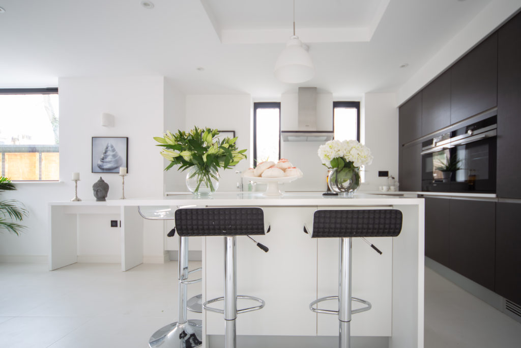 Kitchen with stools and flowers
